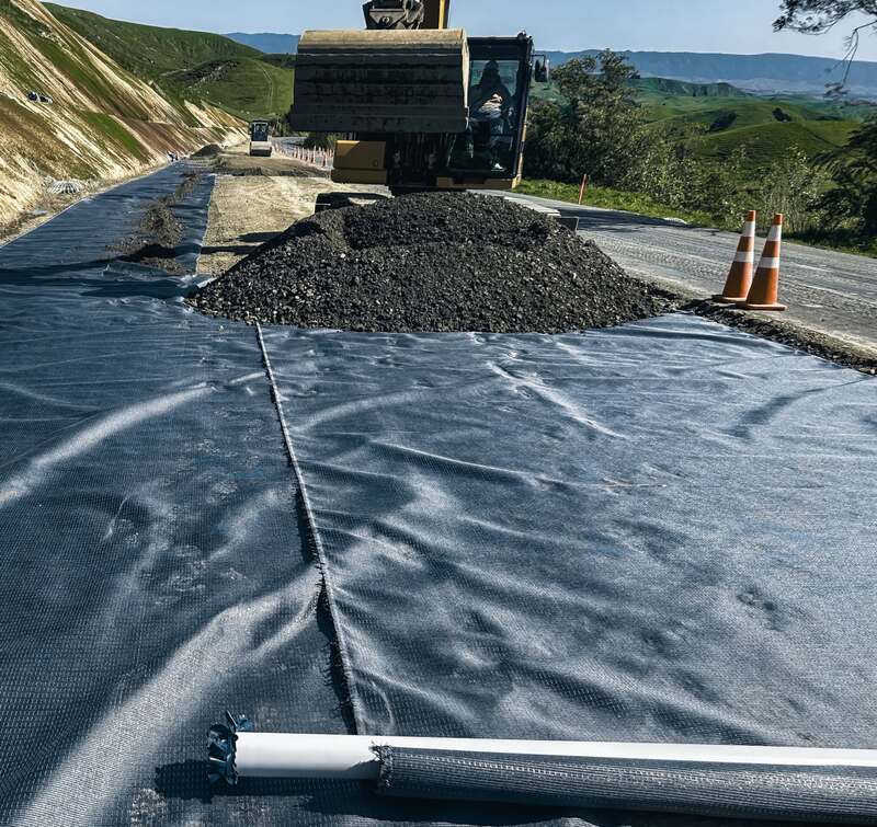 Aggregate placed over Mirafi H2Ri geotextile on a road subgrade
