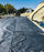 Mirafi H2Ri woven geotextile installed on a roadway with edge drain
