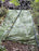 Solmax Miramesh geosynthetic mesh stabilizing a wooded slope
