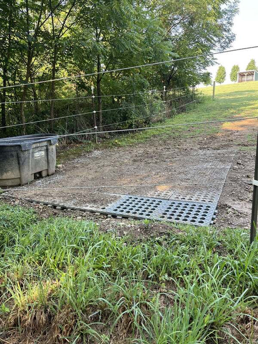 Mud control grid installed in a high-traffic muddy area
