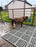 Mud control grid mat installation in a muddy area

