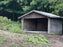Mud control grid flooring in a horse run-in shed
