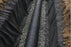 Non-woven geotextile fabric lining a French drain
