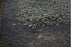 Non-woven geotextile fabric separating soil from gravel
