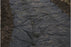 Non-woven geotextile fabric under a woodland drainage path
