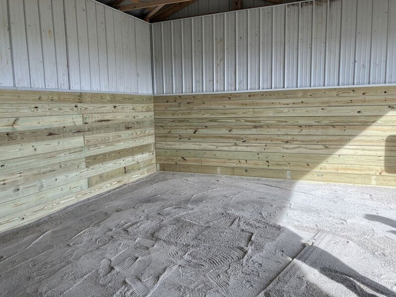 Paddock slab grid filled with sand footing in a horse stall
