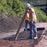 Workers unrolling Solmax Miragrid XT geogrid
