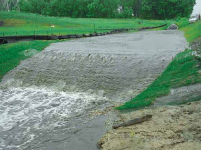 ScourStop mat with water flowing over in culvert ditch