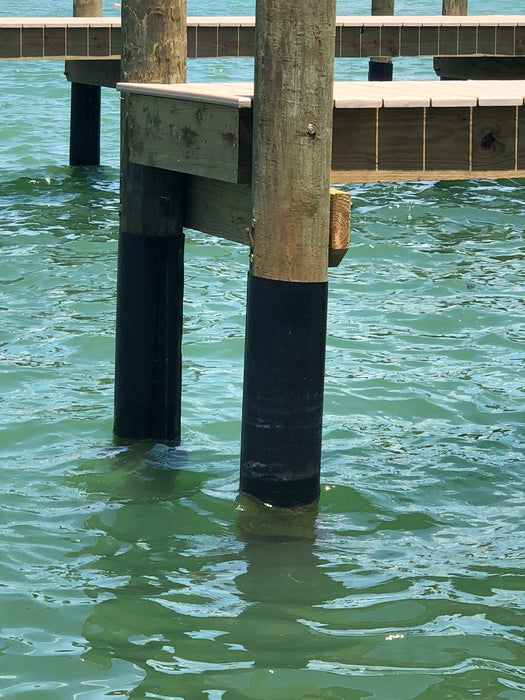 HDPE Plastic Sheeting Wrapped around a dock piling