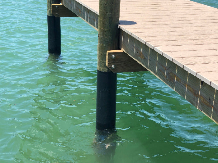 Dock post wrapped in plastic sheeting (dock piling wrap)