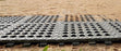 Sand over black plastic paddock grids