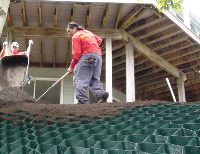 2 men installing geocell grid